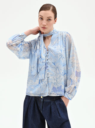 Blusa azzurra in raso con stampa foliage