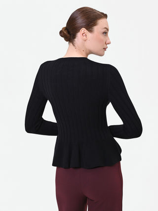 Maglia nera a costine con fondo a peplo