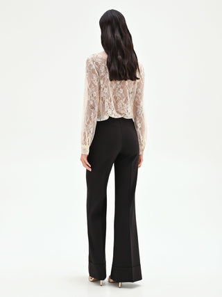High-waisted black trousers with a cuff