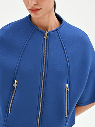 Capospalla cropped blu brillante con zip dorate