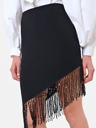 Jupe noire asymétrique à franges lumineuses