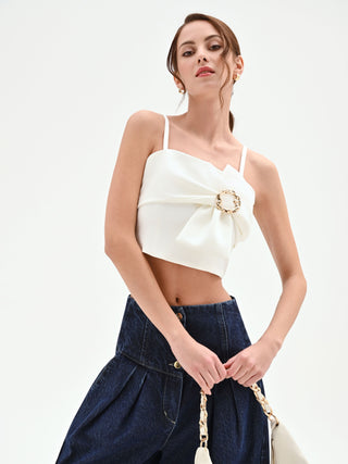 Top crop panna con maxi fiocco