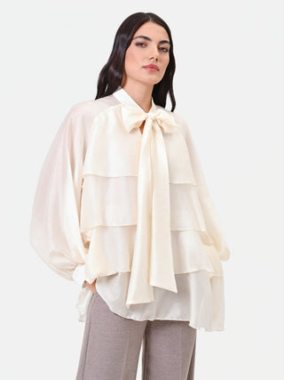 Blusa in lyocell avorio con balze e fiocco
