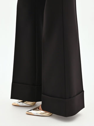 High-waisted black trousers with a cuff