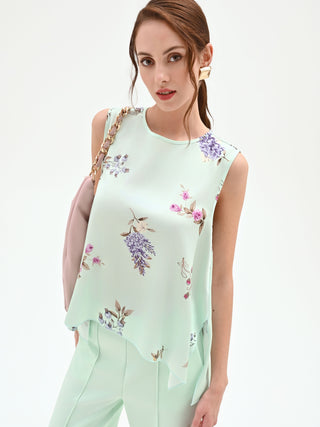 Top color verde menta con stampa a fiori
