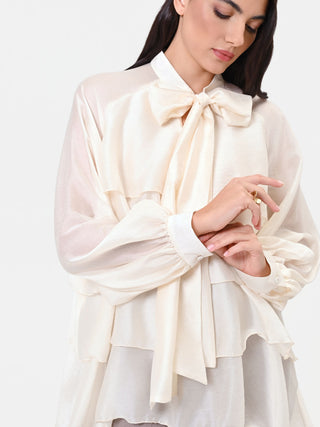 Blusa in lyocell avorio con balze e fiocco