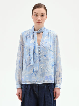 Blusa azzurra in raso con stampa foliage