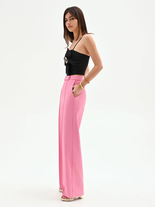 Pink palazzo trousers with a jeweled belt