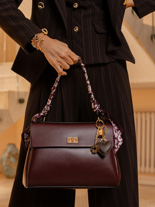 Burgundy handbag with scarf