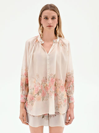 Blouse blanche à imprimé roses