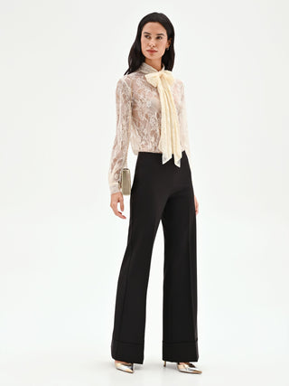 High-waisted black trousers with a cuff