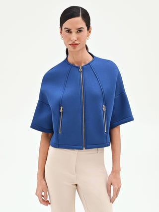 Capospalla cropped blu brillante con zip dorate