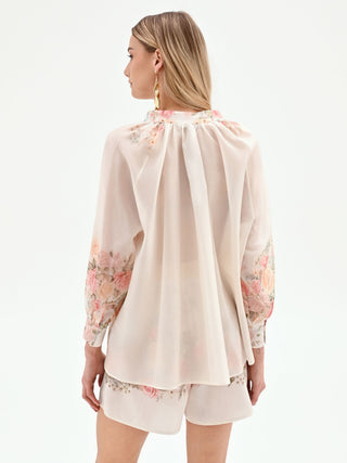 Blouse blanche à imprimé roses