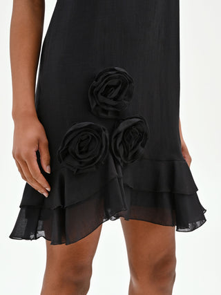 Mini abito nero in lyocell con rose applicate e balze