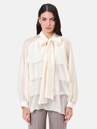 Blusa in lyocell avorio con balze e fiocco