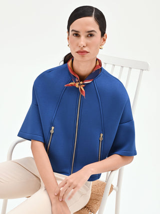 Capospalla cropped blu brillante con zip dorate