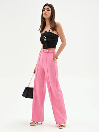 Pink palazzo trousers with a jeweled belt