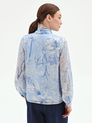 Blusa azzurra in raso con stampa foliage