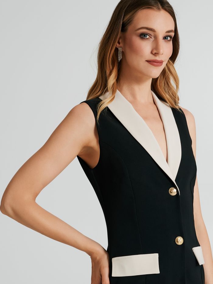 Sleeveless jacket dress in two tones.   Rinascimento