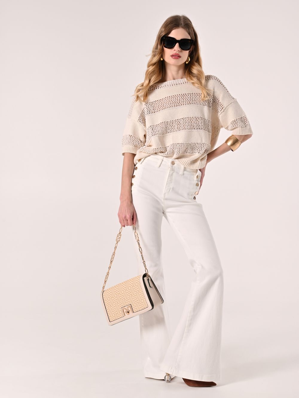 Pantaloni a Zampa con Bottoni in Denim Bianco