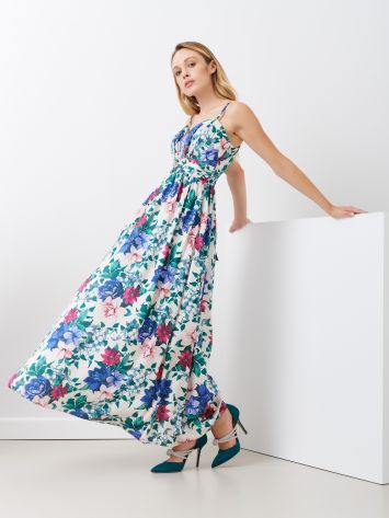 Abito Lungo Stampa Floreale Abito lungo, modello impero, con spalline sottili. L'abito ha le coppe preformate ed è ripreso sul punto vita da una banda drappeggiata.  Il capo è interamente Made in Italy. La modella è alta 1,73 ed indossa la taglia S. Rinascimento