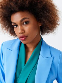 Short jacket with peak lapels Boxy, cropped, open-front jacket with peaked lapels. The garment is made in technical fabric from at least 25% recycled polyester. The jacket has 3/4 sleeves and two-toned monogram lining. The garment can be worn both as a classic jacket and as a shrug to pair with dresses and jumpsuits. The model is 1.73 m tall and wears size S. The garment is completely made in Italy. Rinascimento