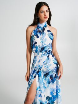 Abito portafoglio con fantasia a fiori  Abito lungo stile impero realizzato in raso. Scollo all'americana con piccolo cut a goccia sulla parte davanti. La gonna a ruota è un modello portafoglio con un profondo spacco laterale. Sul retro del collo è presente una romantica chiusura tramite fiocco regolabile. Abito con fantasia a fiori perfetto per le carimonie, da accessoriare con gioielli brillanti e décolleté con strass. Il capo è interamente made in Italy. La modella è alta 1,77 m ed indossa la taglia S. Rinascimento