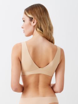 Genova bra top Soft microfibre bra top with low V-neckline at the front and back. 
Soft microfibre bra top: cut and heat-sealed seams come together to create a bra that is invisible under garments. 
The comfort and excellent fit are ensured by the absence of wires and by the heat-sealed band under the bust. 
A versatile bra, suitable to wear on all occasions, thanks to its removable padded cups. Rinascimento